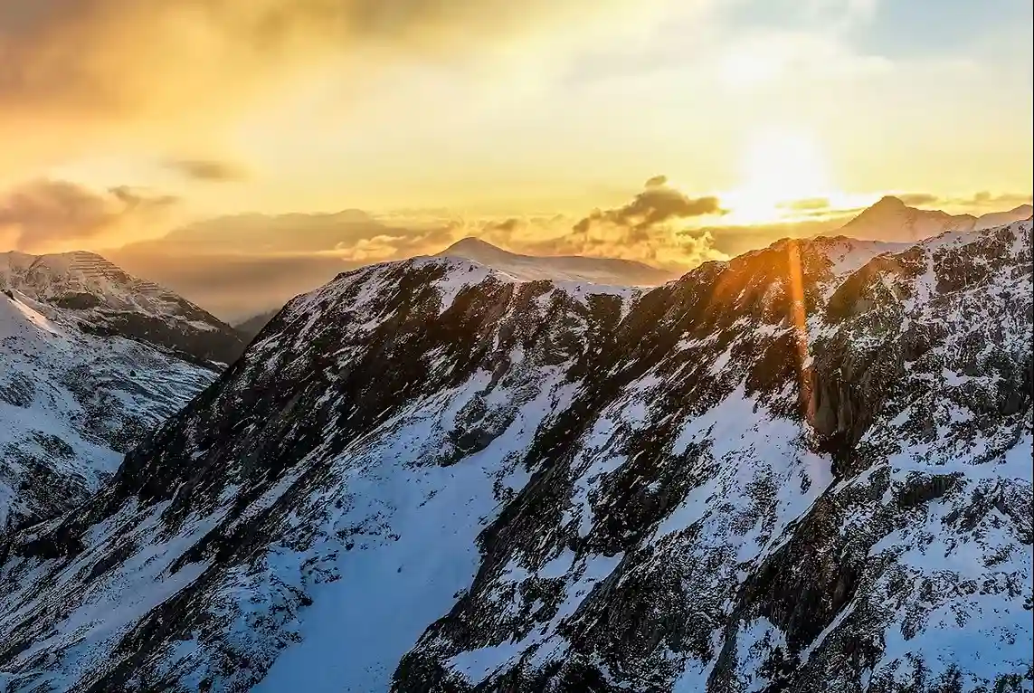 Sunset Over Snowy Mountains